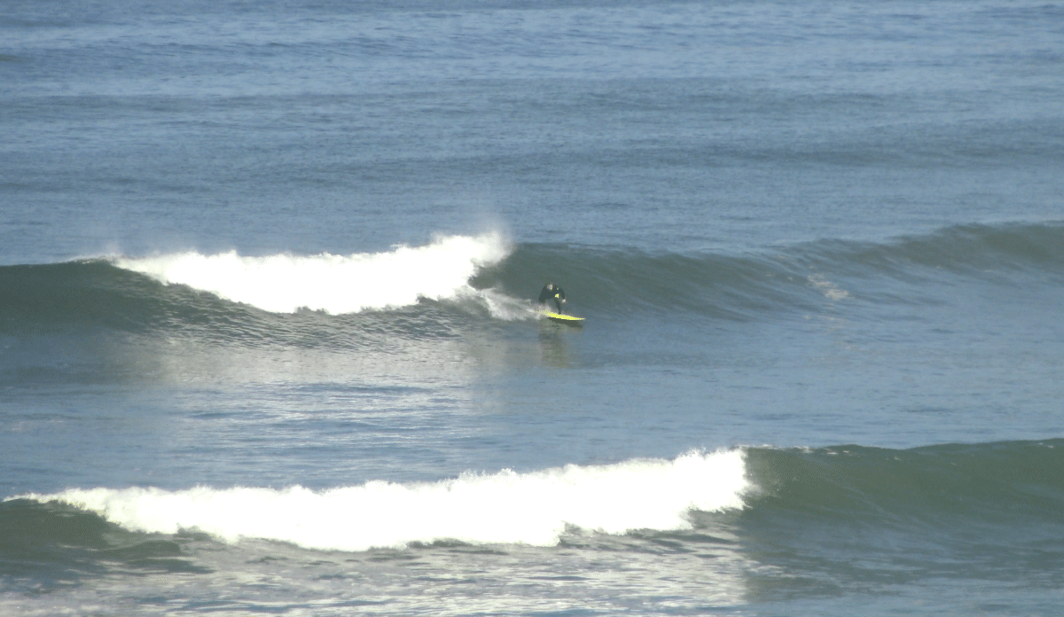 Surfer navigating a large wave in Morocco.