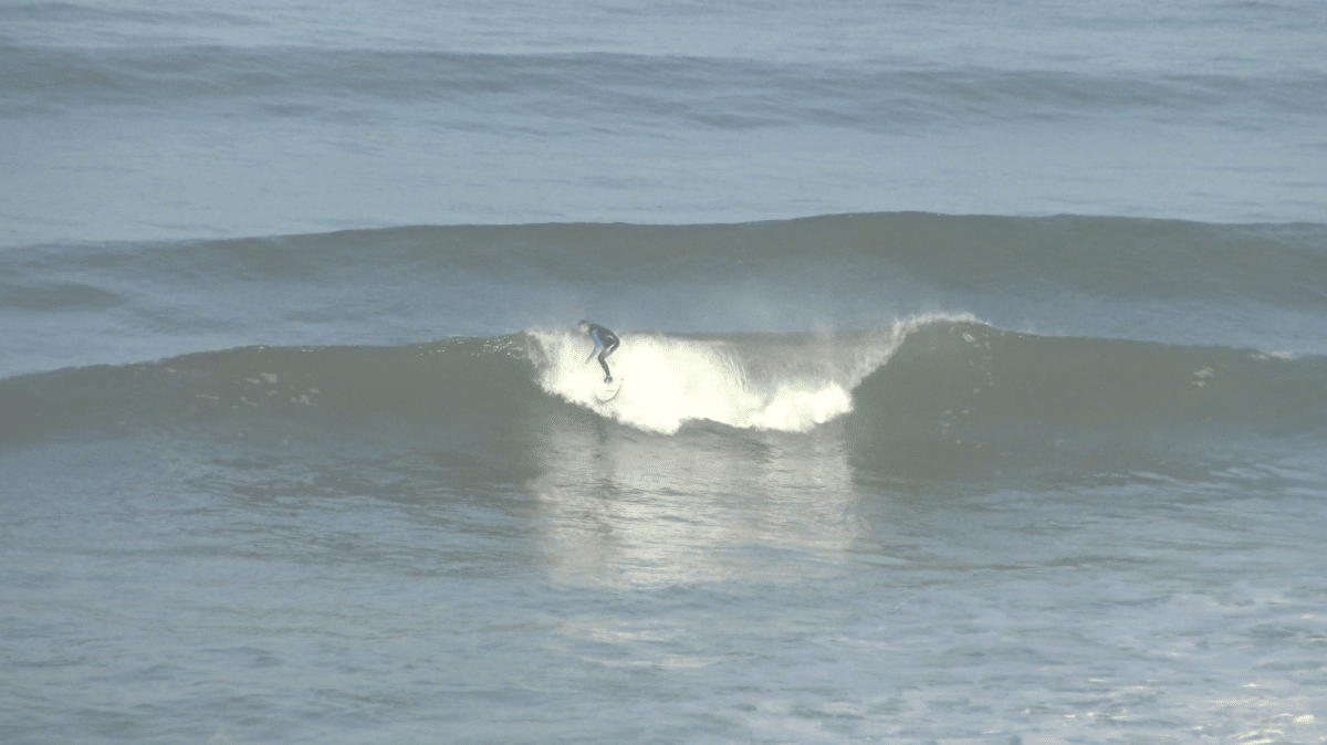 Surfer riding a wave in Morocco.